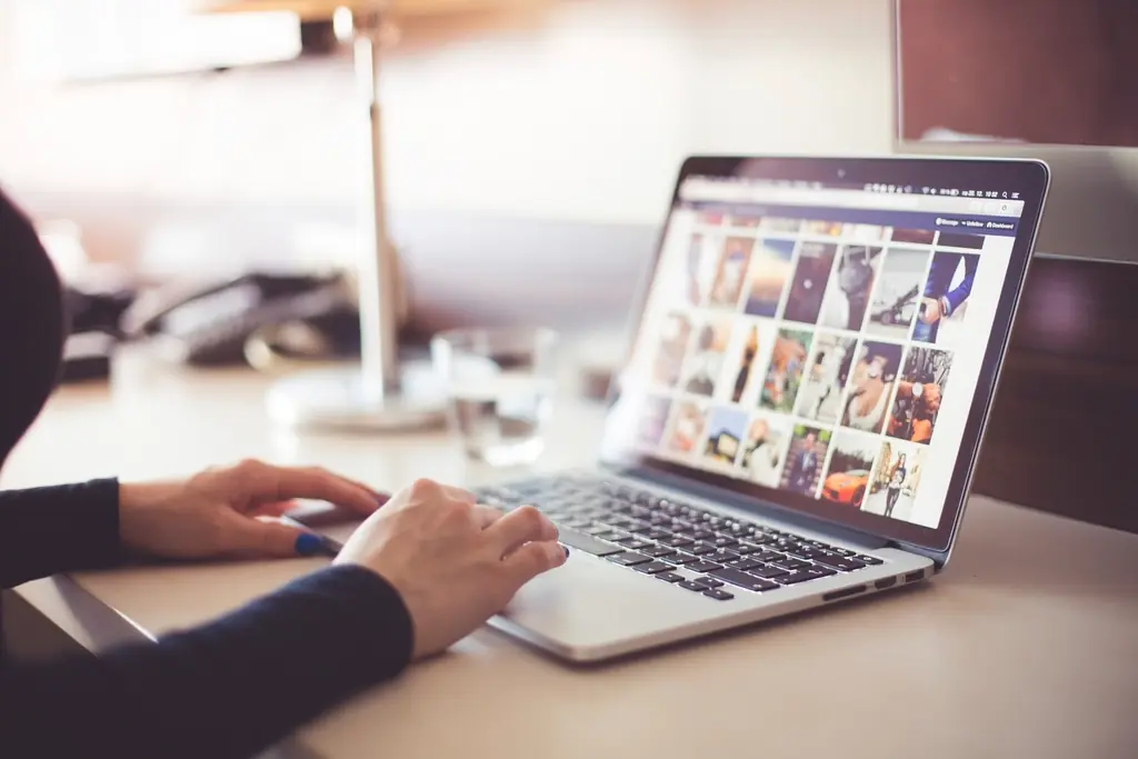 Woman using laptop office